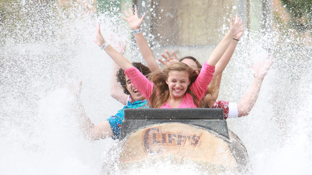 Guests getting splashed on the Rocky Mountain Rapids