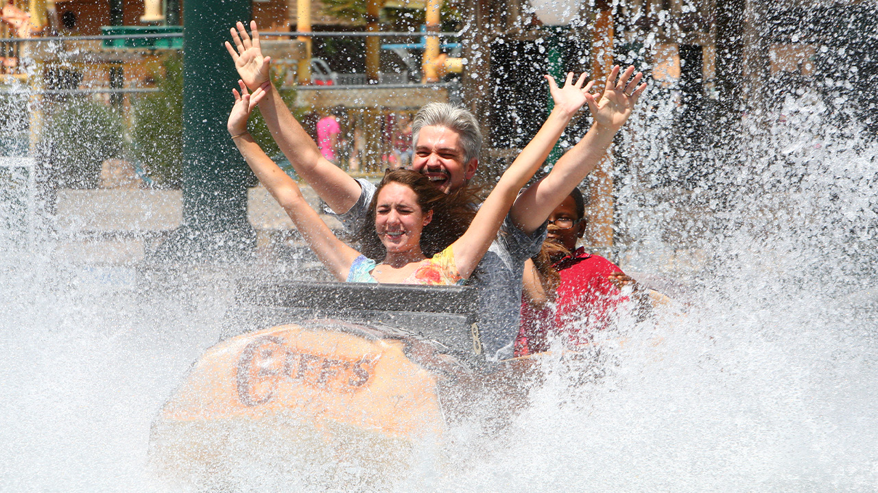 Guests getting splashed on the Rocky Mountain Rapids