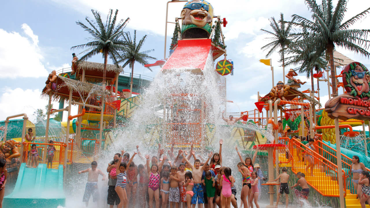 Guests at Watermania under the dunking bucket